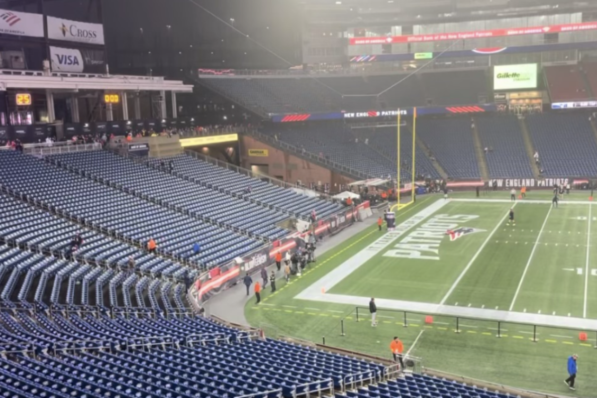 New England Patriots players warm up before the beginning of their game against the Chicago Bears in 2023.